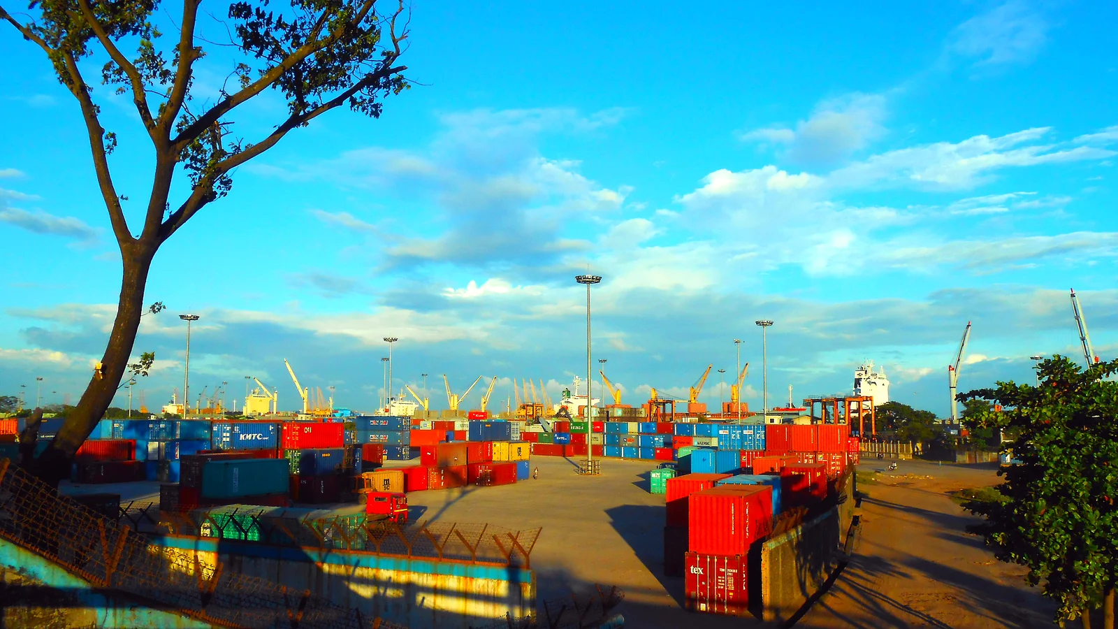 Stacked containers and cranes in the container yard at the Port of Chittagong