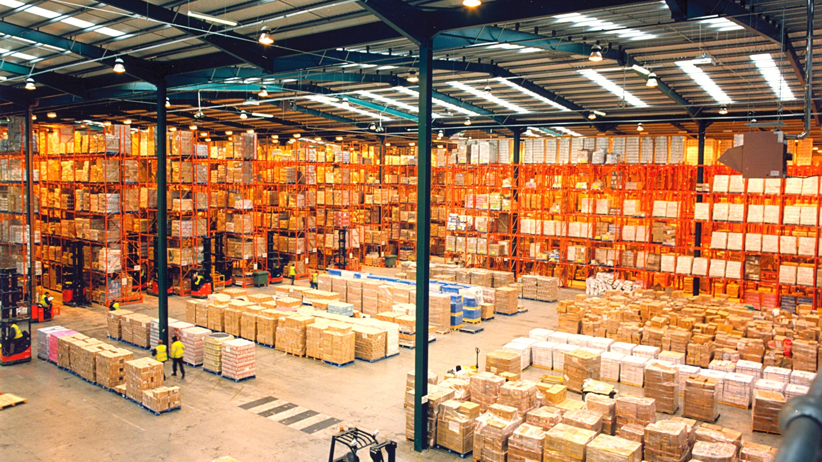Large warehouse with pallet racks and boxed goods ready for shipping