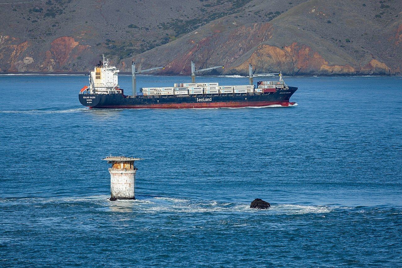 Mile Rocks Light with Container ship Sealand Balboa outside the Golden Gate